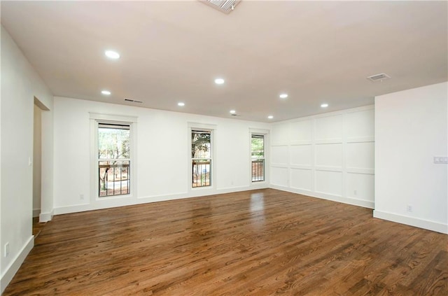 empty room featuring dark wood-type flooring