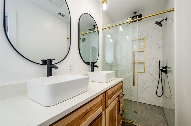 bathroom featuring vanity and walk in shower