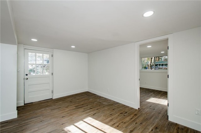 interior space featuring dark hardwood / wood-style flooring and plenty of natural light