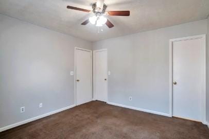 bathroom with tiled shower / bath combo and toilet