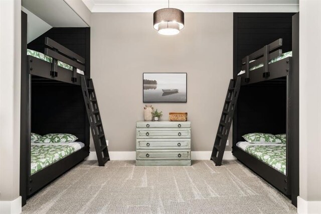 carpeted bedroom featuring baseboards
