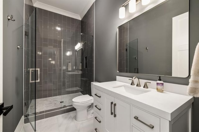 full bathroom featuring a shower stall, vanity, marble finish floor, toilet, and ornamental molding