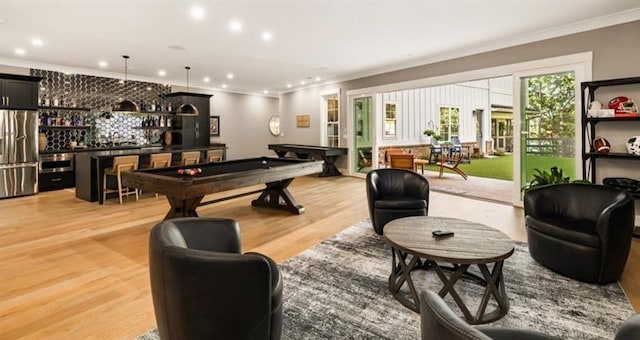 game room with light wood-type flooring, recessed lighting, a bar, billiards, and crown molding