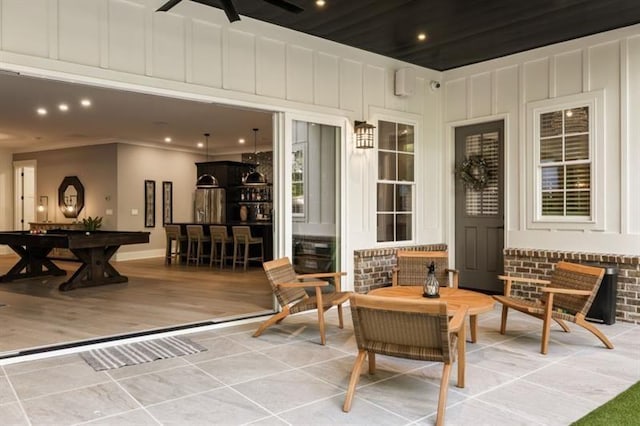 view of patio featuring ceiling fan