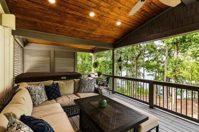 deck featuring outdoor lounge area and ceiling fan