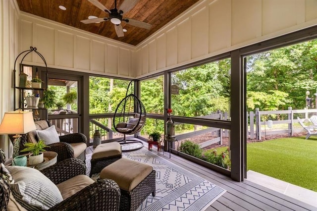 sunroom with ceiling fan and a healthy amount of sunlight