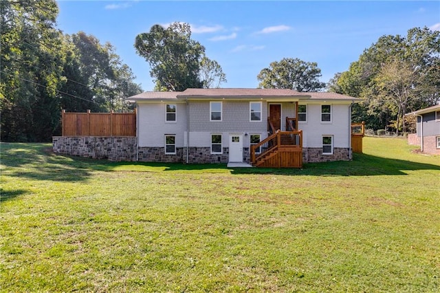 back of house featuring a lawn