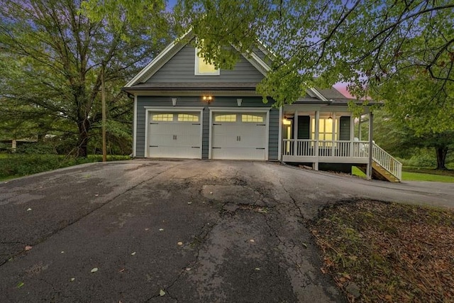 craftsman-style home with covered porch and a garage