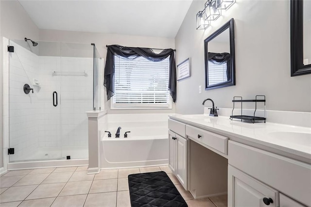 bathroom featuring tile patterned flooring, shower with separate bathtub, and vanity