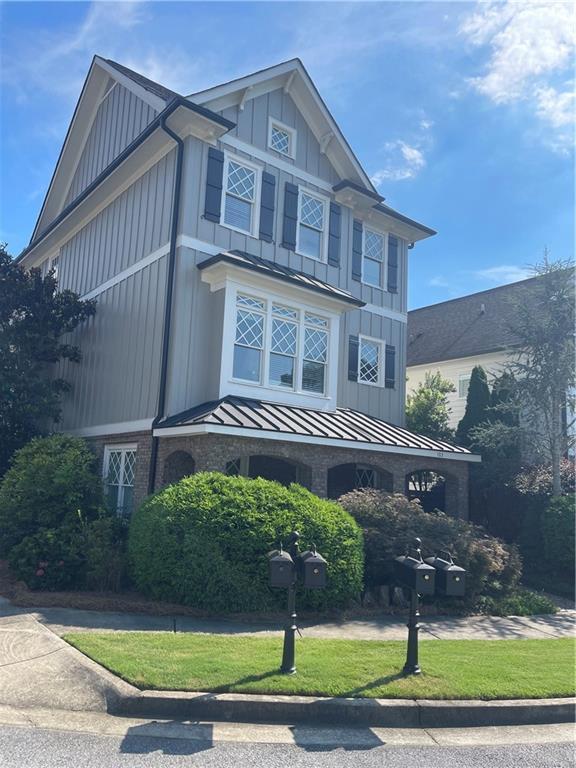 103 Mill Park Chase, Woodstock, GA 30188 - craftsman-style home with a standing seam roof, a metal roof, and board and batten siding
