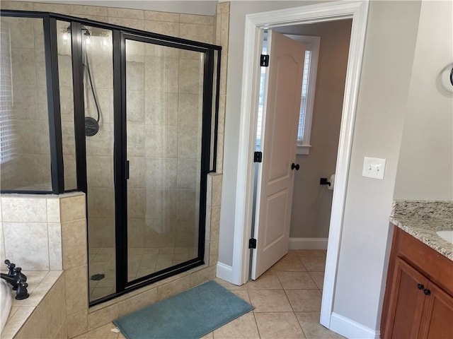 103 Mill Park Chase, Woodstock, GA 30188 - bathroom with a shower stall, a garden tub, vanity, and tile patterned floors