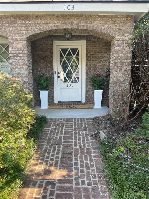 103 Mill Park Chase, Woodstock, GA 30188 - doorway to property with brick siding and a porch