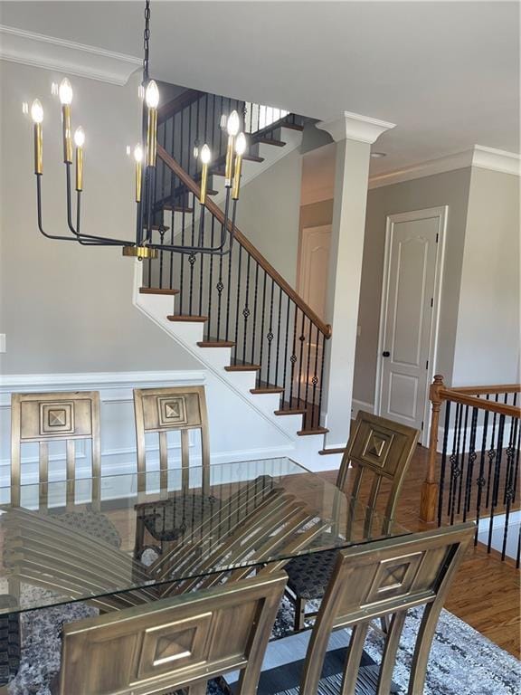 103 Mill Park Chase, Woodstock, GA 30188 - staircase with ornamental molding, wood finished floors, and a chandelier