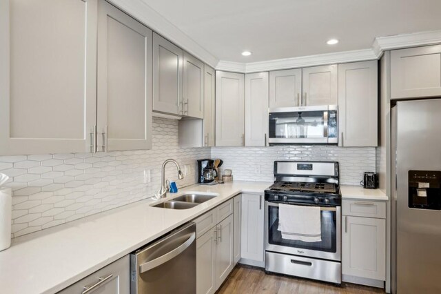 215 Piedmont Ave NE Unit 2103, Atlanta, GA 30308 - kitchen featuring light countertops, a sink, stainless steel appliances, and gray cabinets