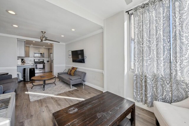 215 Piedmont Ave NE Unit 2103, Atlanta, GA 30308 - living room with light wood finished floors, recessed lighting, ceiling fan, and ornamental molding