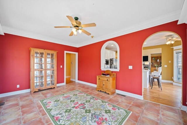 kitchen with sink, white cabinets, a center island, stainless steel appliances, and light hardwood / wood-style flooring