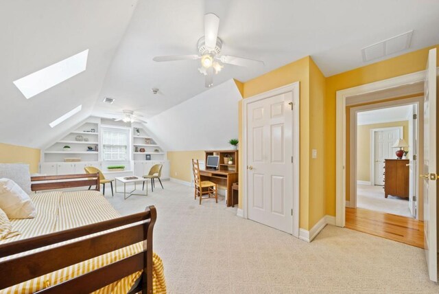 carpeted bedroom with crown molding and ceiling fan