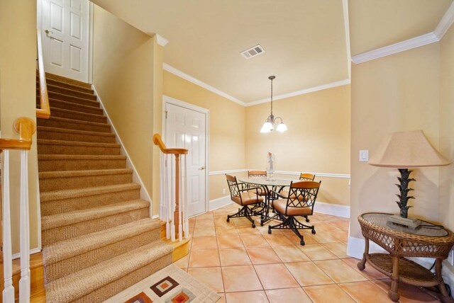 bedroom with crown molding, light colored carpet, and ceiling fan