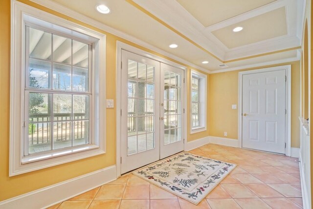 dining space with light tile patterned flooring, ornamental molding, and a chandelier