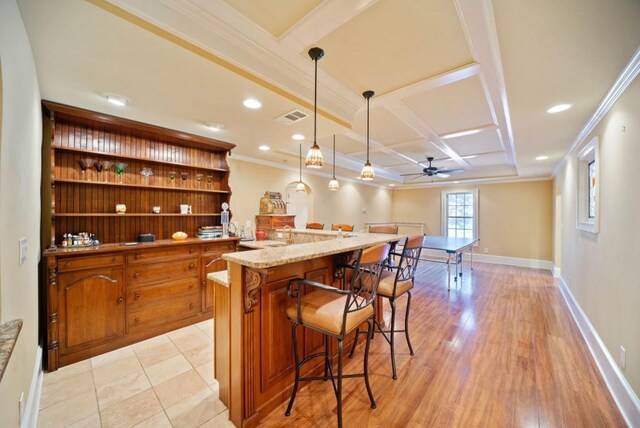 game room with crown molding, beamed ceiling, coffered ceiling, and light wood-type flooring