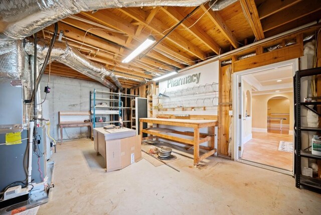 bedroom with a tray ceiling, ornamental molding, ceiling fan, and hardwood / wood-style flooring