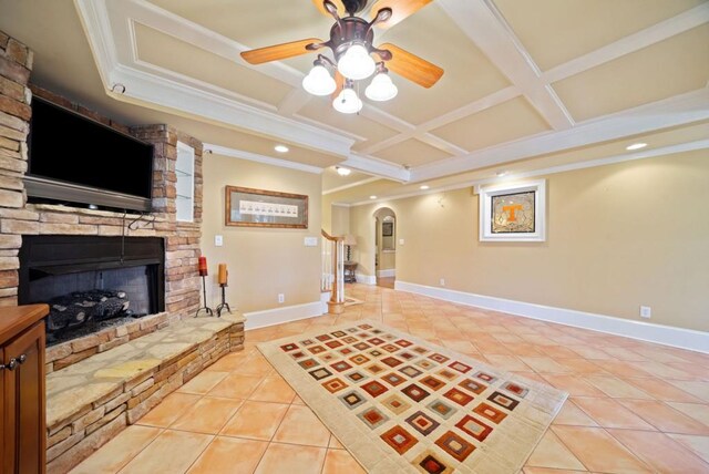 unfurnished sunroom with ceiling fan and a water view