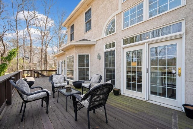 view of patio / terrace with ceiling fan and a water view