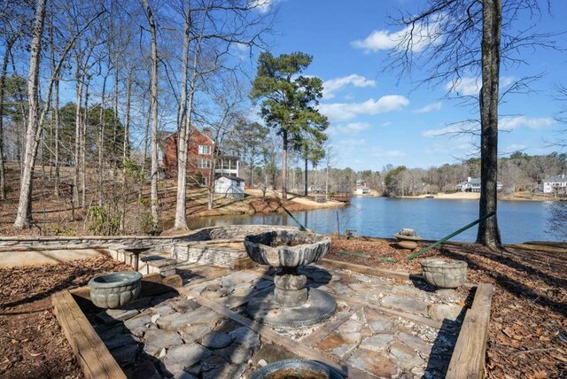 view of patio with a water view