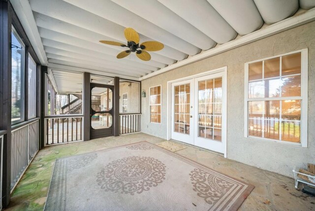 view of home's exterior with a wooden deck and a lawn