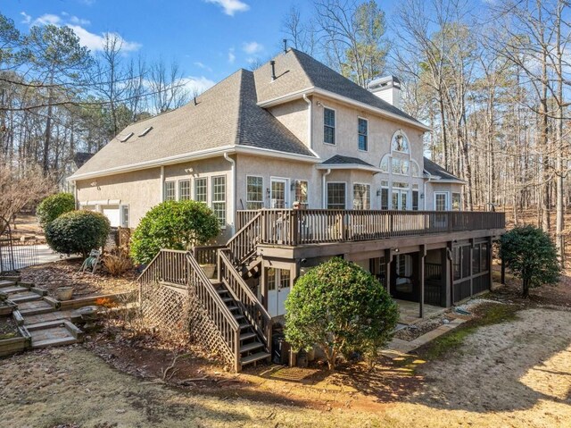 back of property with a wooden deck