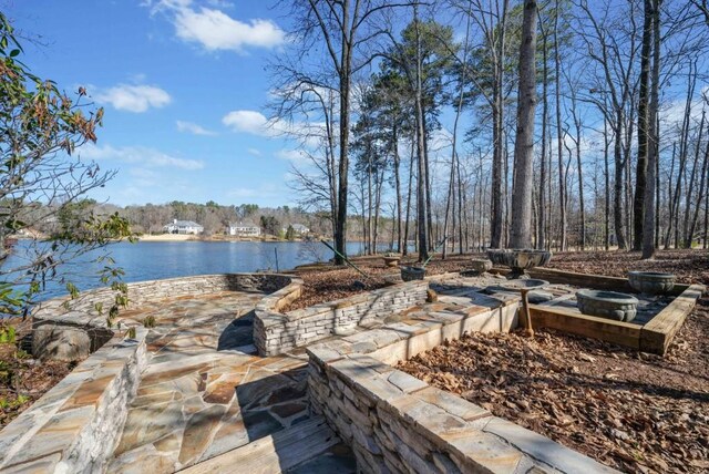 back of house featuring a water view