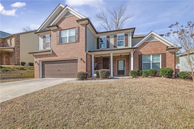 view of front of house with a garage and a front yard