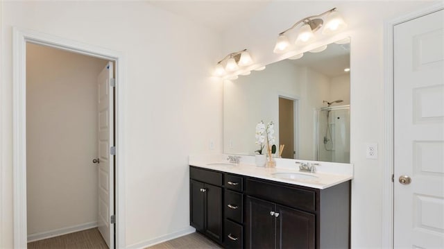 231 Malbone St SW, Cartersville, GA 30120 - full bathroom with a shower stall, double vanity, and baseboards