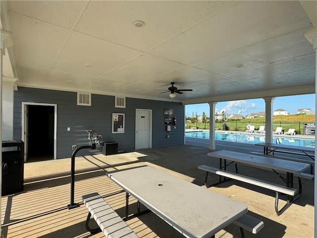 231 Malbone St SW, Cartersville, GA 30120 - view of patio / terrace with a community pool, ceiling fan, and fence