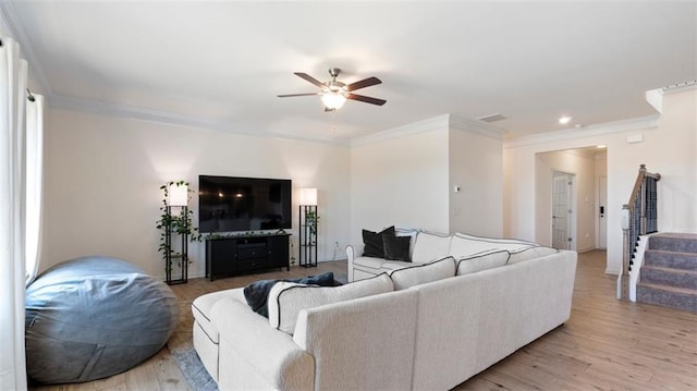 231 Malbone St SW, Cartersville, GA 30120 - living room with a ceiling fan, crown molding, light wood finished floors, stairway, and recessed lighting