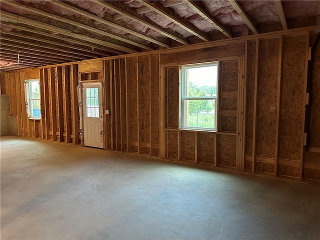 misc room featuring concrete flooring and a healthy amount of sunlight