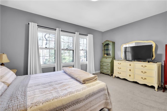 bedroom with light colored carpet