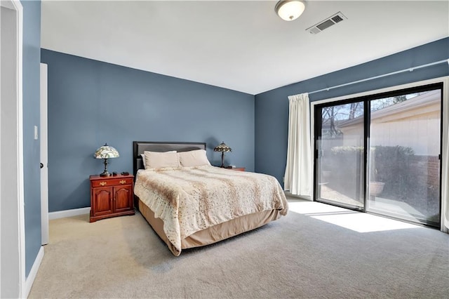 carpeted bedroom with access to exterior, visible vents, and baseboards