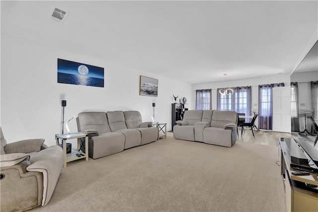 carpeted living area with visible vents