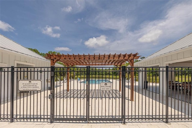 gate with fence, a pergola, and a community pool