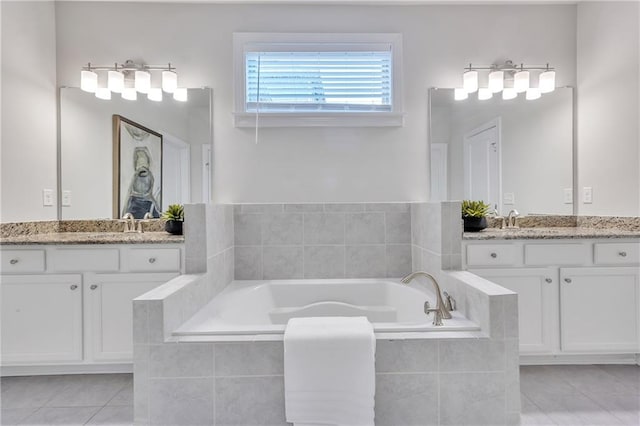 6179 Ashbranch Dr, Acworth, GA 30101 - bathroom featuring two vanities, a garden tub, and tile patterned flooring