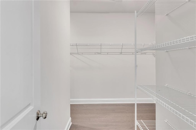 6179 Ashbranch Dr, Acworth, GA 30101 - walk in closet with wood finished floors
