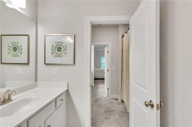 6179 Ashbranch Dr, Acworth, GA 30101 - full bath featuring vanity, baseboards, marble finish floors, and ensuite bathroom