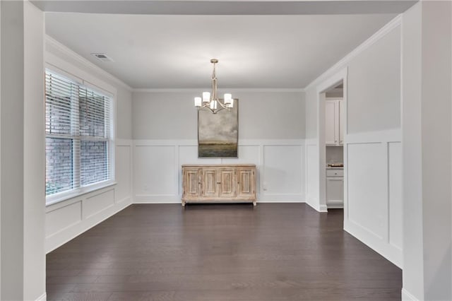 6179 Ashbranch Dr, Acworth, GA 30101 - unfurnished dining area with a decorative wall, a chandelier, ornamental molding, dark wood-style floors, and a wainscoted wall