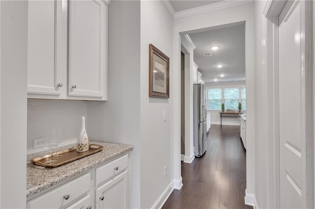 6179 Ashbranch Dr, Acworth, GA 30101 - hallway with ornamental molding, baseboards, dark wood-style floors, and recessed lighting