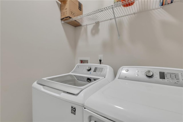 laundry area featuring laundry area and washer and clothes dryer