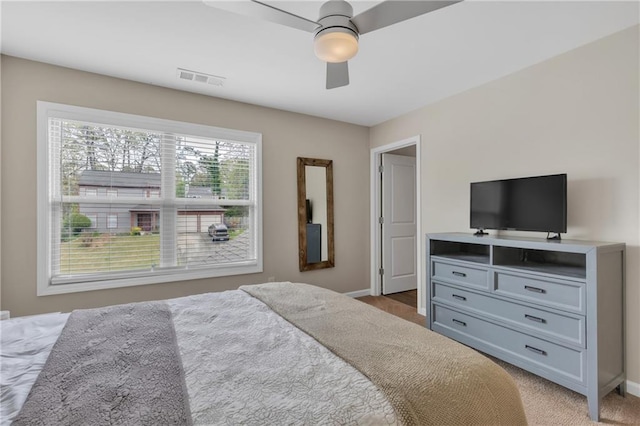 bedroom with visible vents, ceiling fan, and baseboards