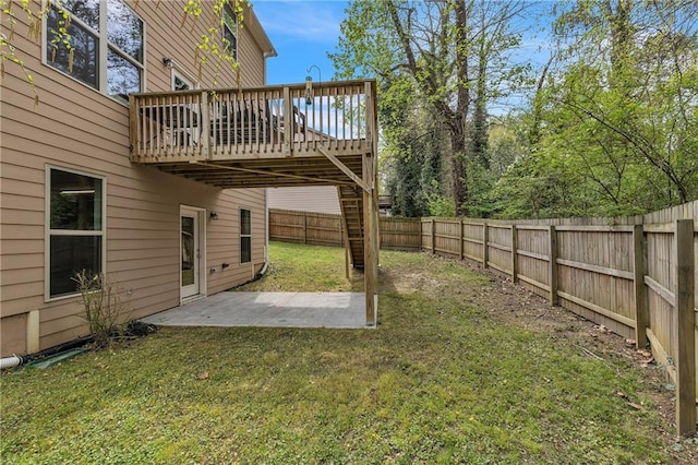 view of yard with stairs, a patio area, a fenced backyard, and a wooden deck