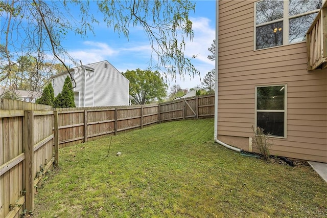 view of yard with a fenced backyard