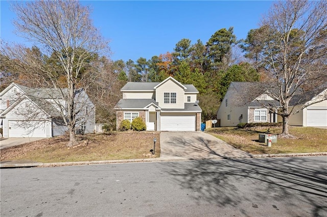 traditional home featuring a garage and driveway